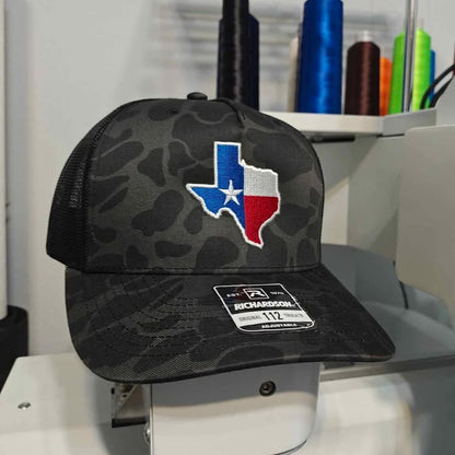 Texas Flag + Come & Take It Canon Richardson 112 Trucker Hat Black Duck Camo Print